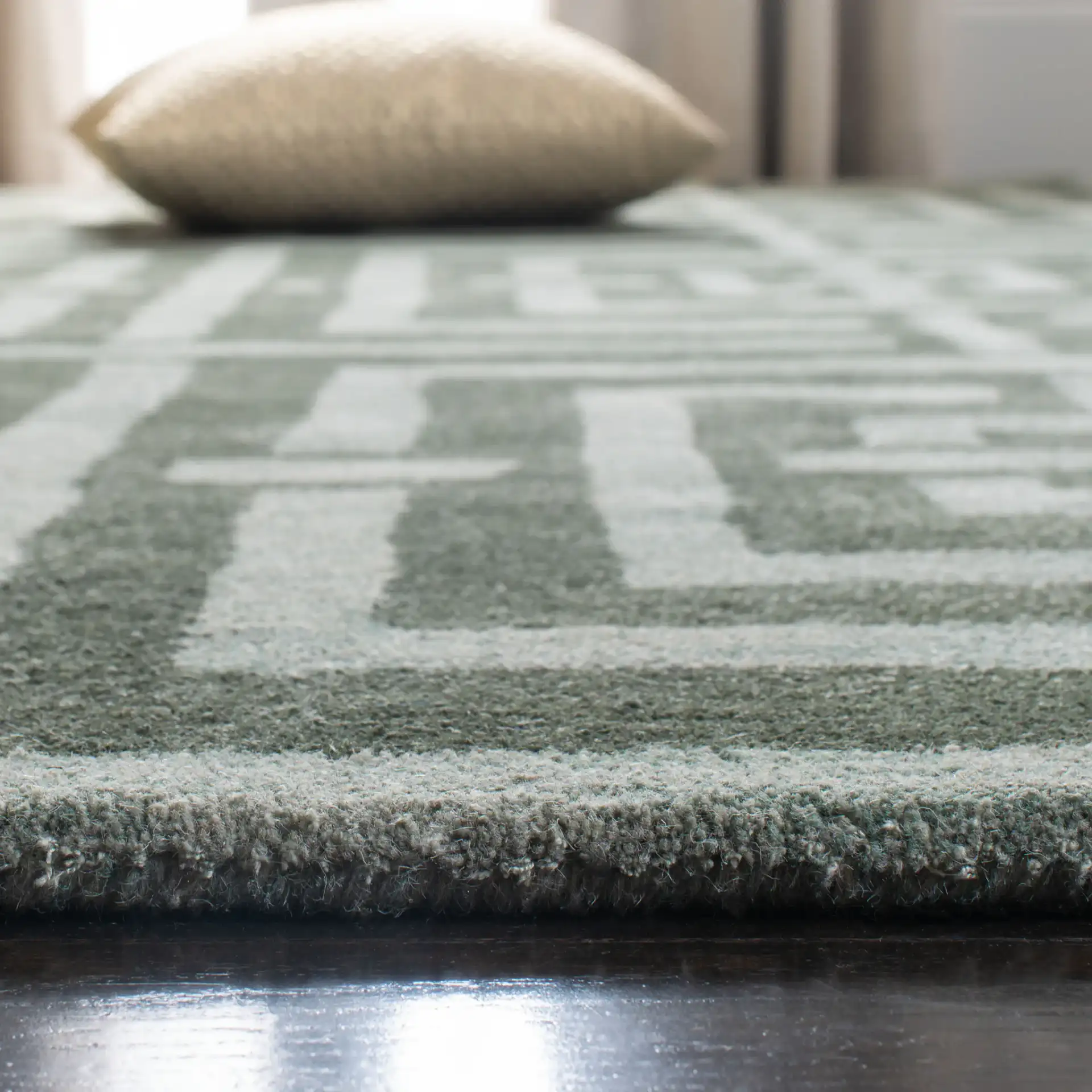 Wyndham Euclid Hand-Tufted Wool Rug in Sage in a styled room
