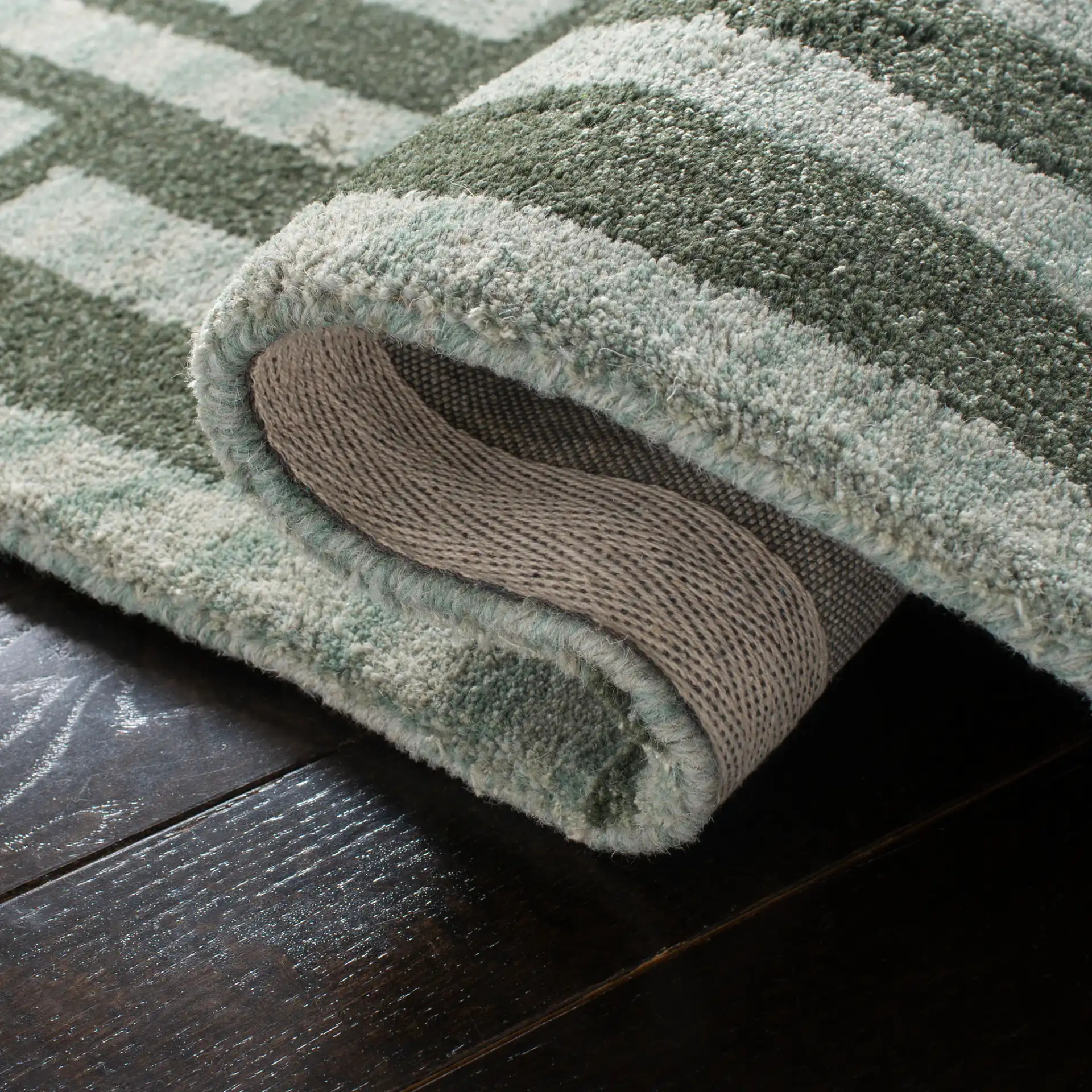 Wyndham Euclid Hand-Tufted Wool Rug in Sage in a styled room