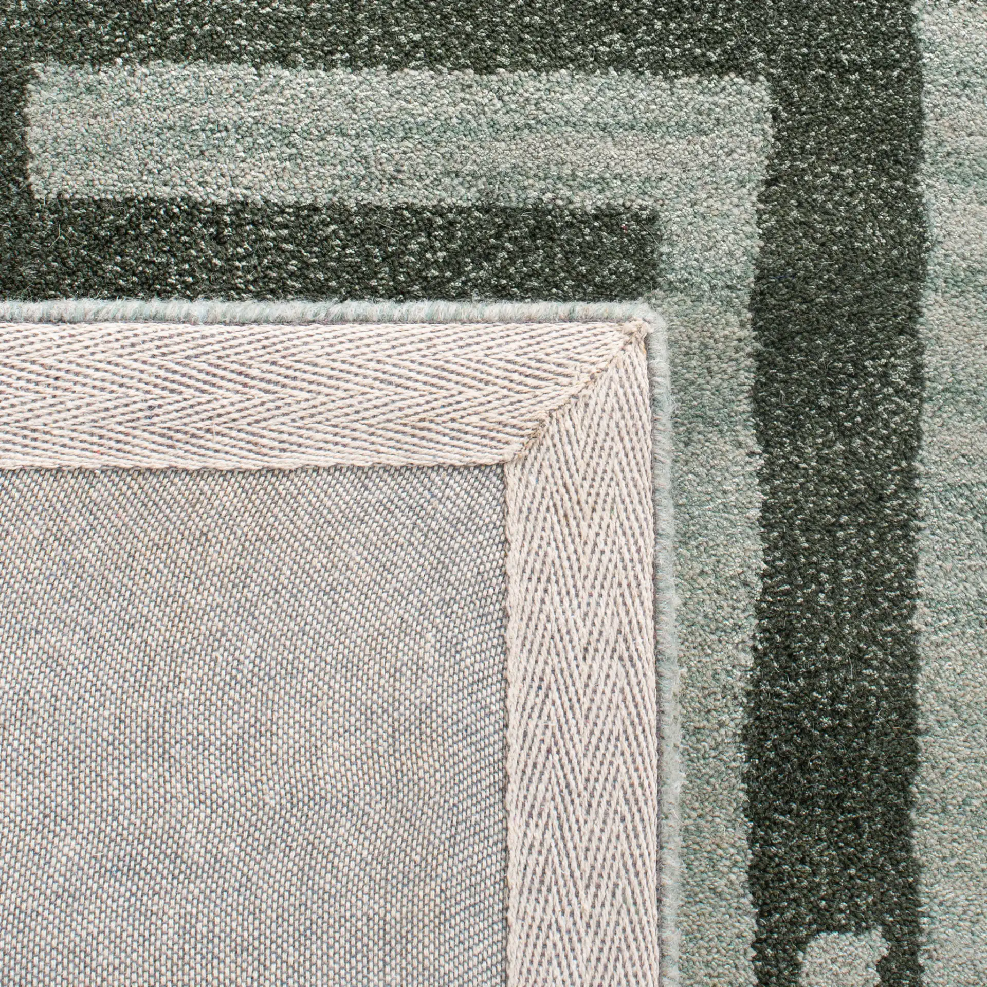 Wyndham Euclid Hand-Tufted Wool Rug in Sage in a styled room