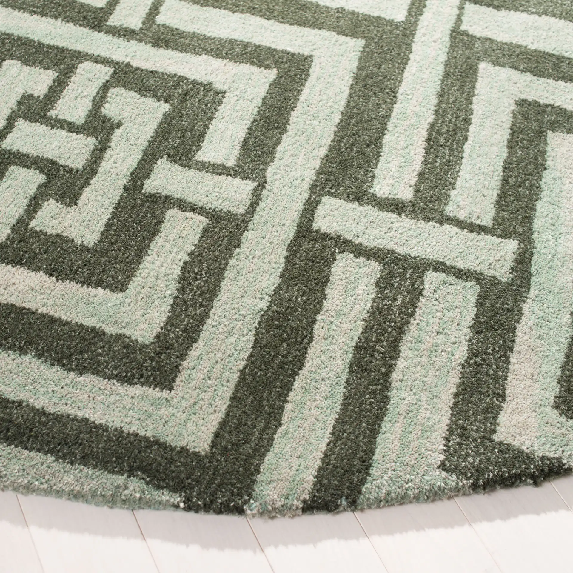 Wyndham Euclid Hand-Tufted Wool Rug in Sage in a styled room