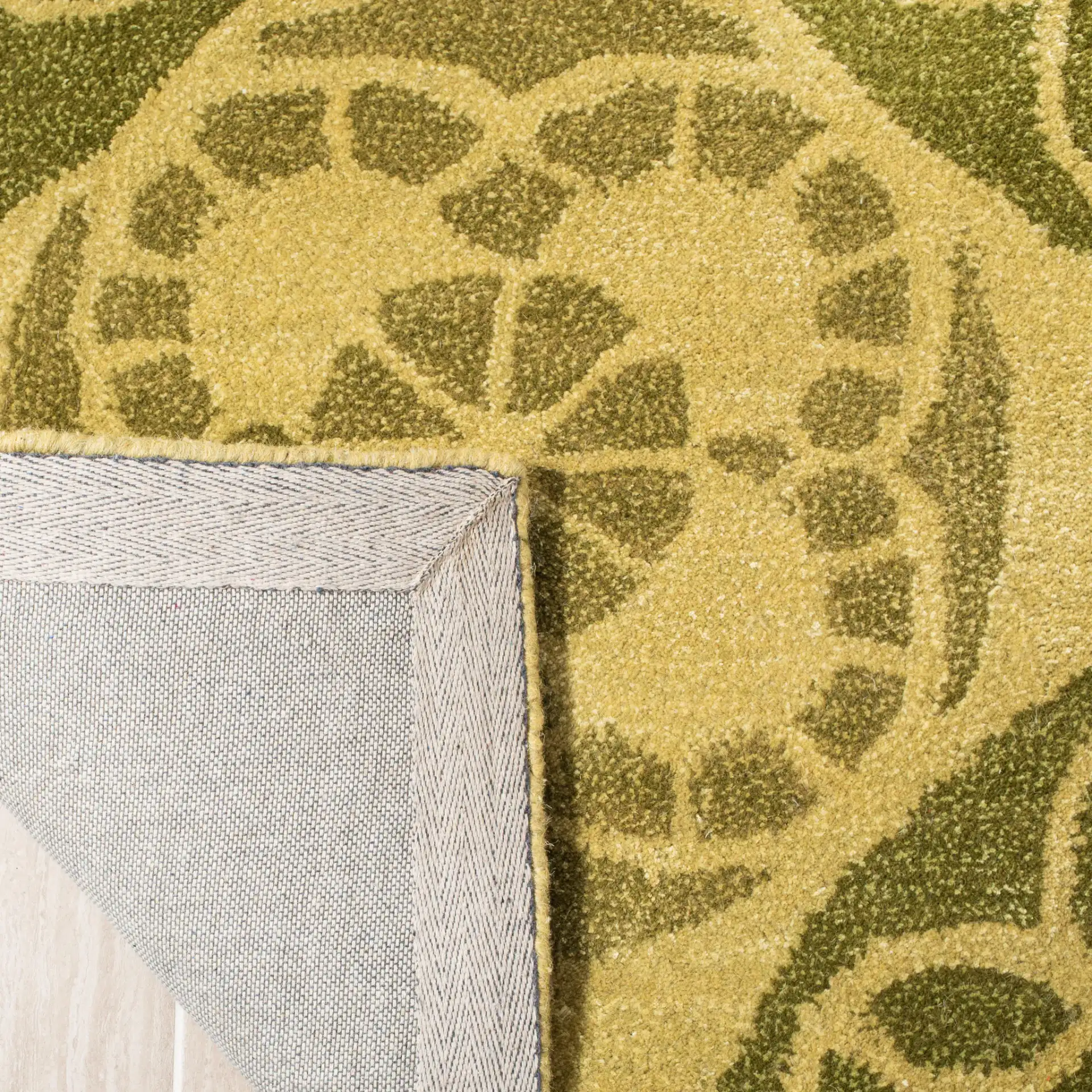 Wyndham Circular Medallion Hand-Tufted Rug in Honey / Green in a styled room