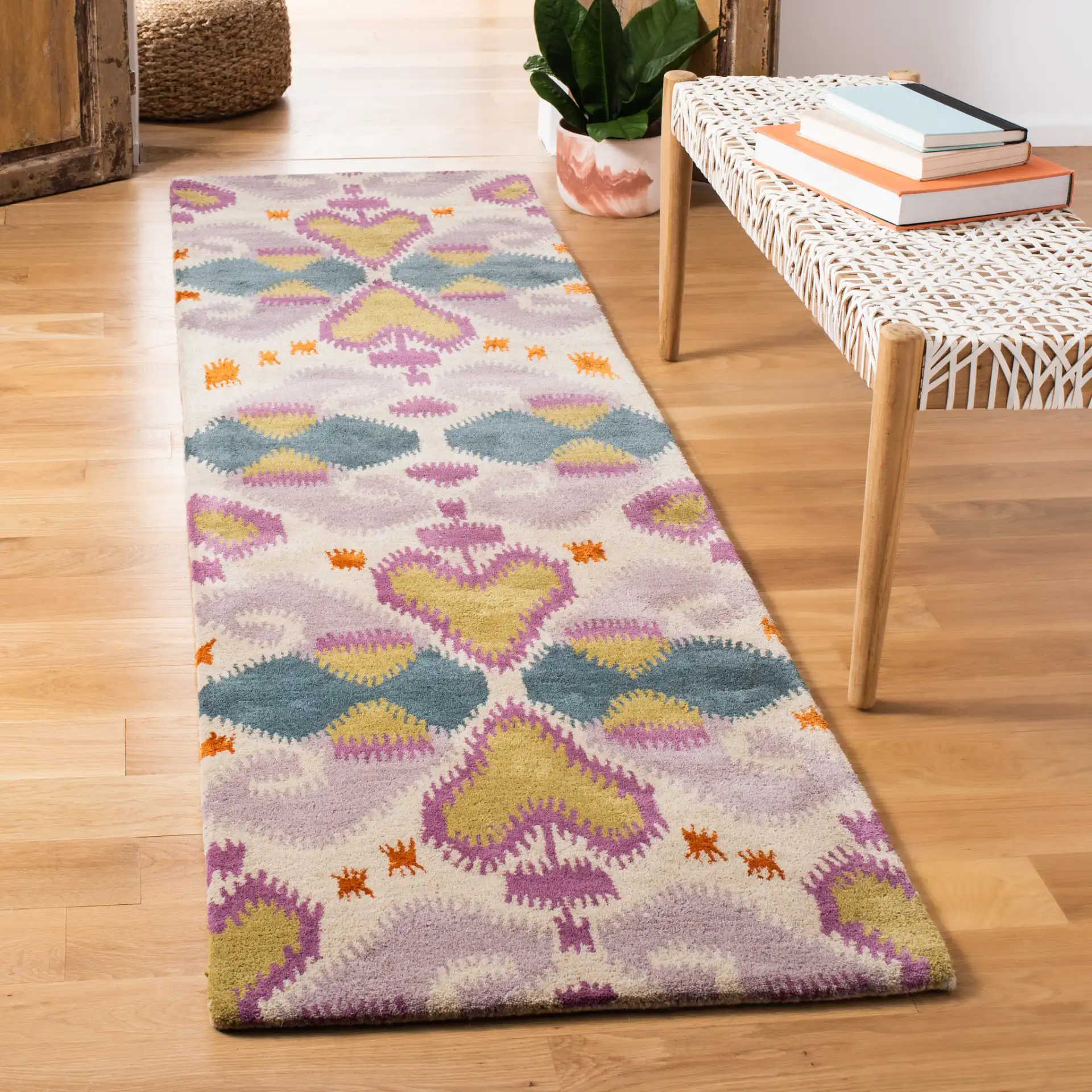 Wyndham Ikat Medallion Wool Rug in Ivory / Multicolor in a styled room