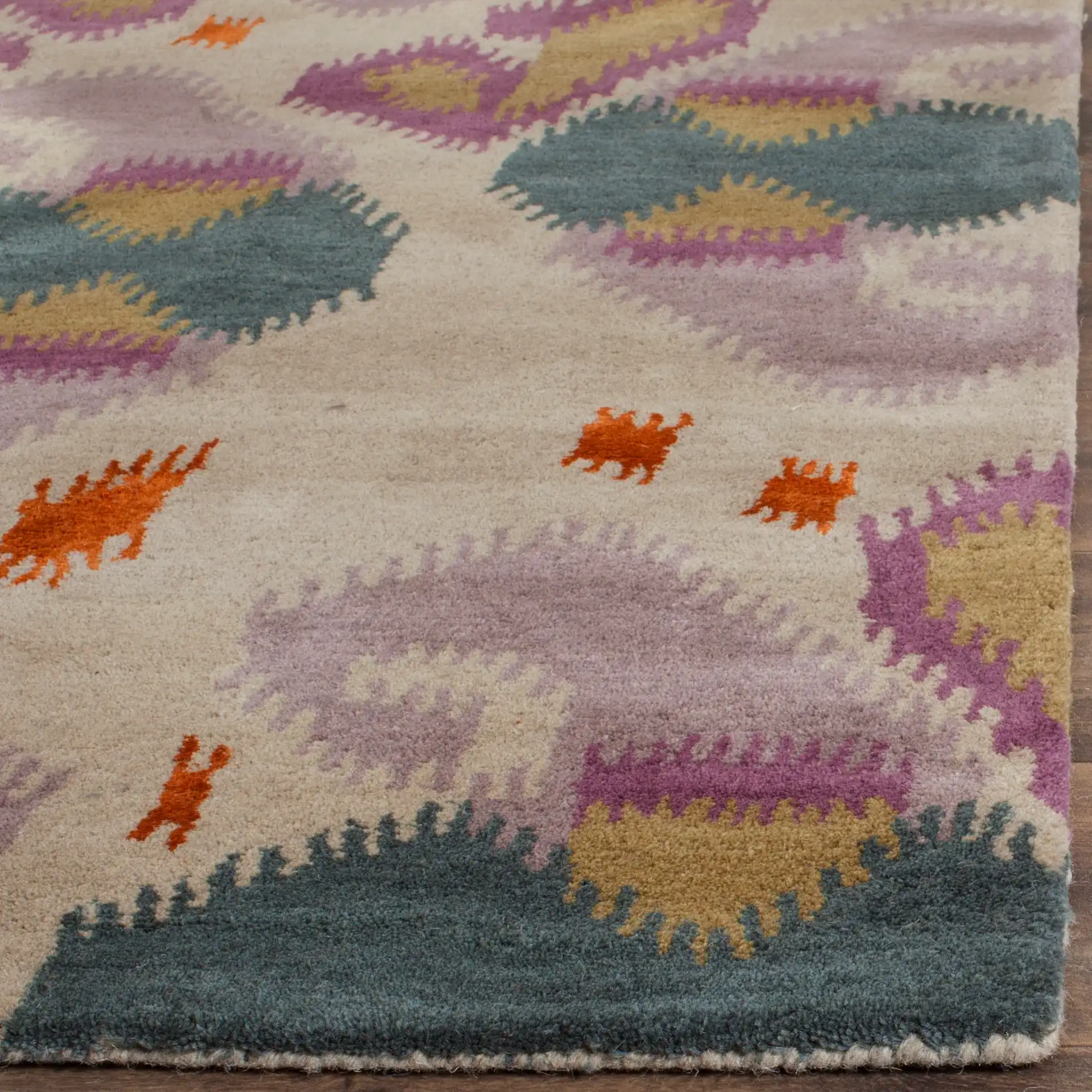 Wyndham Ikat Medallion Wool Rug in Ivory / Multicolor in a styled room