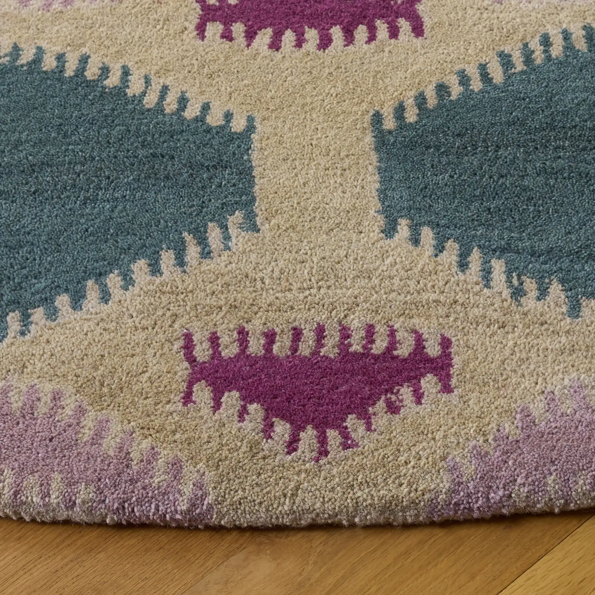 Wyndham Ikat Medallion Wool Rug in Ivory / Multicolor in a styled room