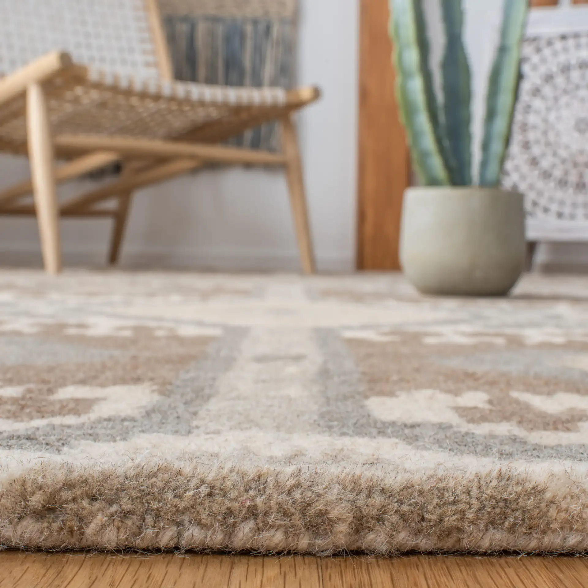 Wyndham Ikat Diamond Hand-Tufted Wool Rug in Natural / Multicolor in a styled room