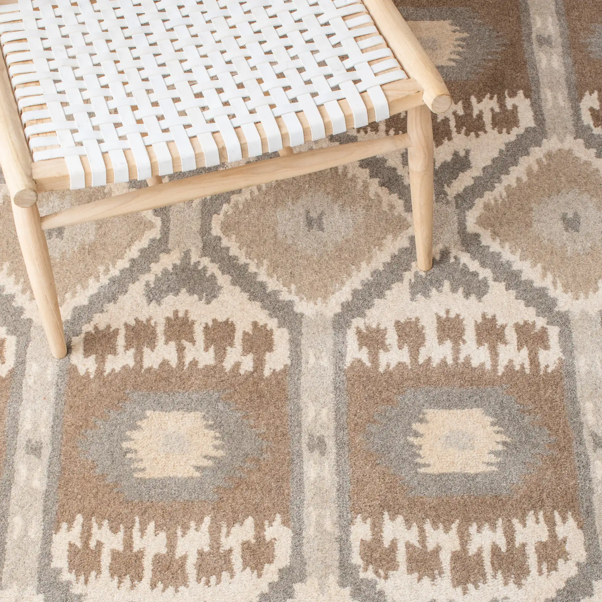 Wyndham Ikat Diamond Hand-Tufted Wool Rug in Natural / Multicolor in a styled room