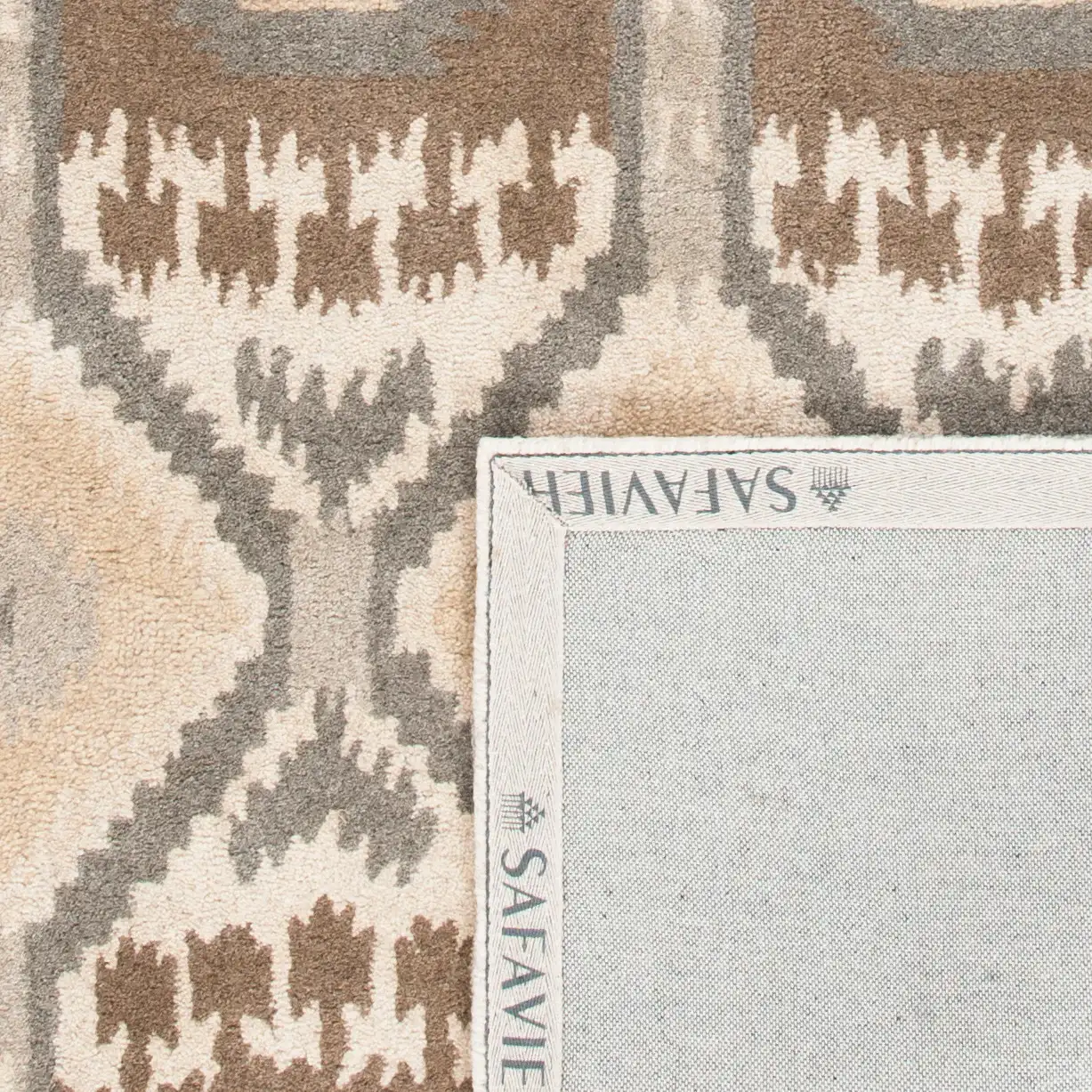 Wyndham Ikat Diamond Hand-Tufted Wool Rug in Natural / Multicolor in a styled room